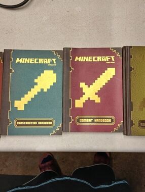 Scholastic Minecraft Hardcover Handbooks in Teal, Red, and Olive